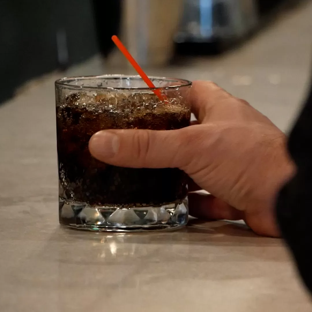 hand holding a beverage