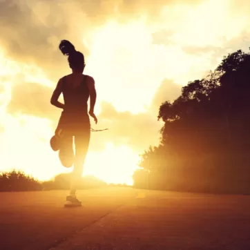 woman running at sunrise