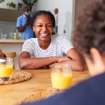 woman and tow children at the breakfast table