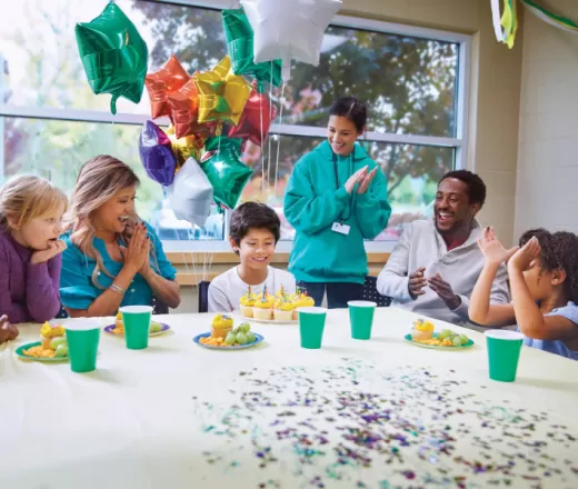 happy children and parents at a YMCA birthday party