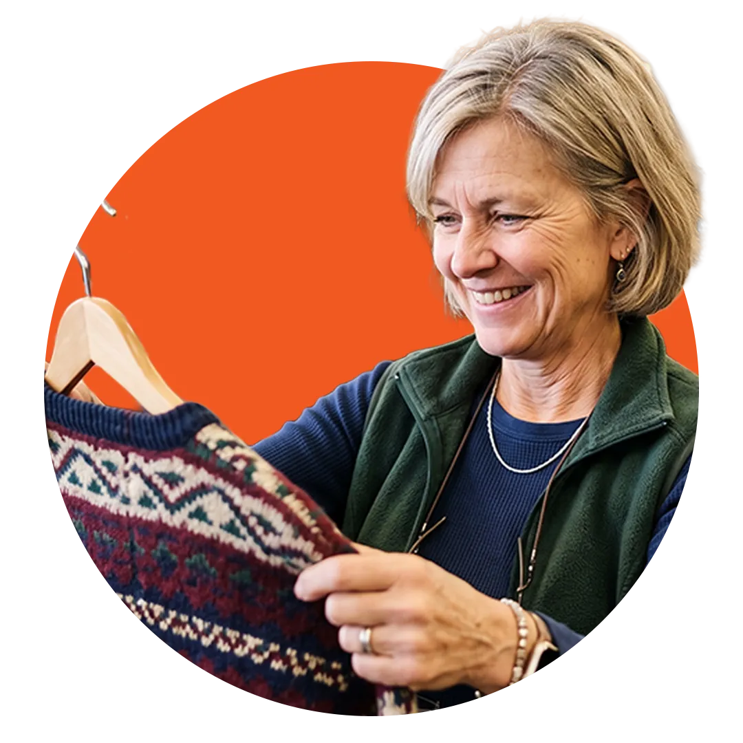 woman admiring a vintage sweater