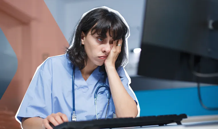 tired nurse using the computer