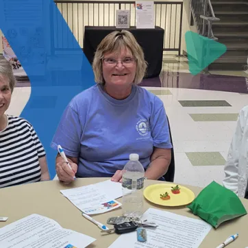 3 women sitting around a table at the YMCA