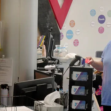 YMCA member checking in at the front desk