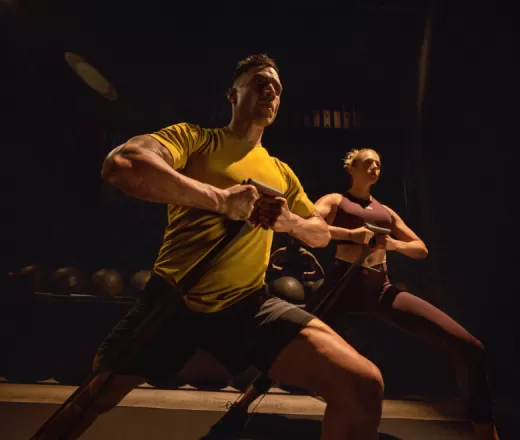 A man and a woman doing a core workout