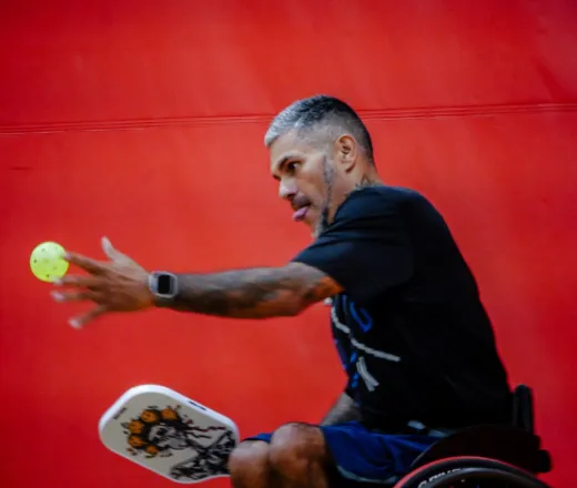 man playing pickleball in the gymnasium